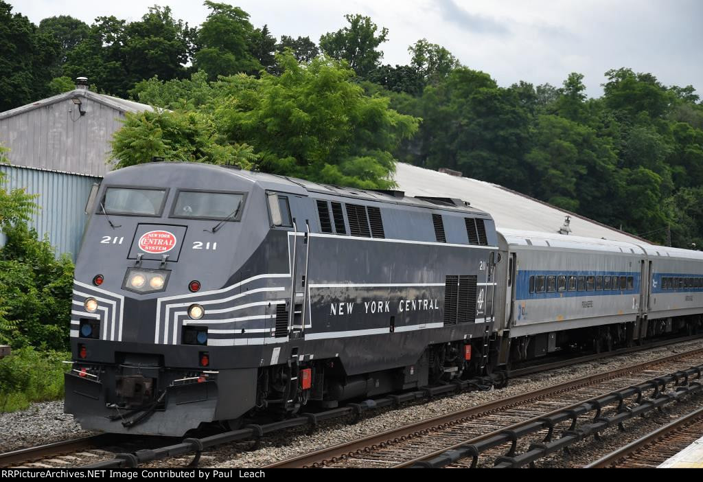 Outbound commuter approaches the station behind the New York Central heritage unit